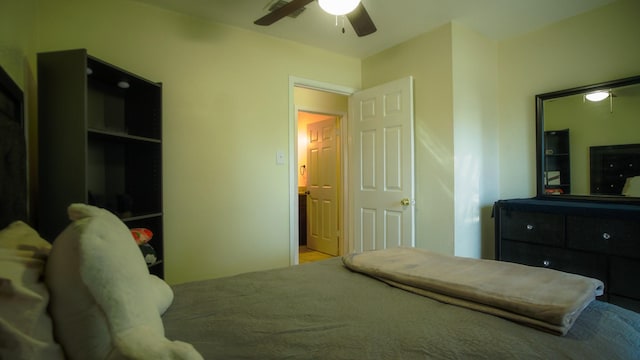 bedroom with ceiling fan and a closet