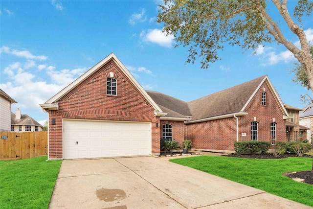 front facade with a garage and a front lawn