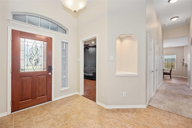 entryway with light tile patterned floors