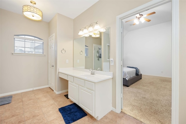 bathroom featuring ceiling fan and vanity