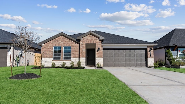 view of front of property with a front lawn and a garage