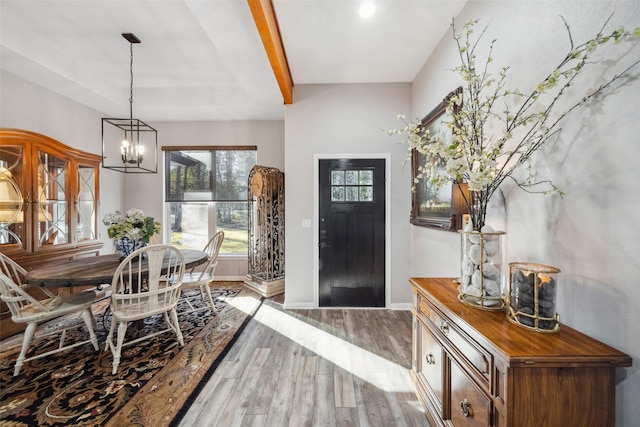 entrance foyer with a notable chandelier and light wood-type flooring