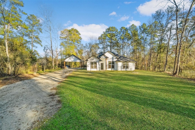 ranch-style house with a carport and a front lawn