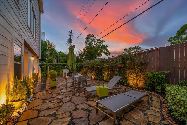 view of patio terrace at dusk