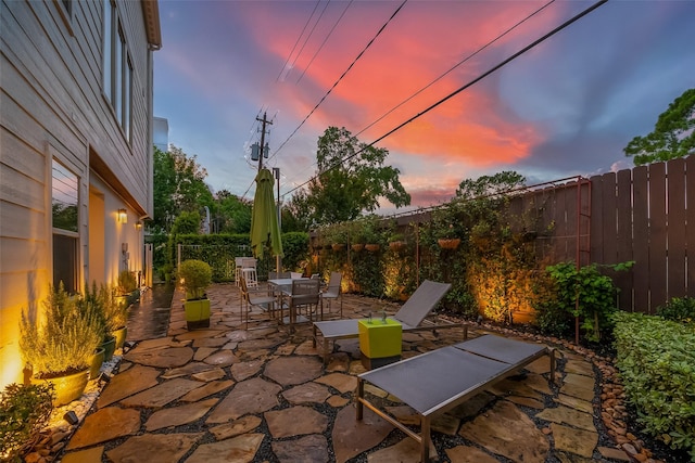 view of patio terrace at dusk