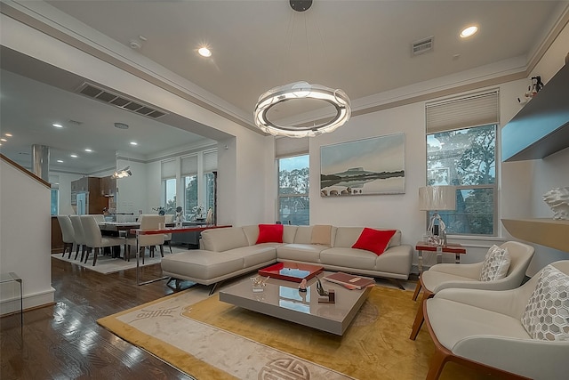 living room featuring wood-type flooring and ornamental molding