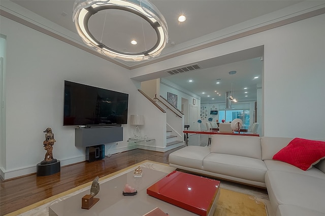 living room featuring ornamental molding and hardwood / wood-style floors