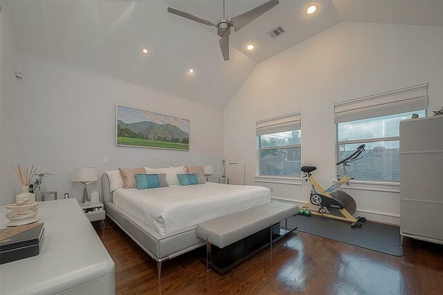 bedroom with ceiling fan, vaulted ceiling, and dark hardwood / wood-style floors