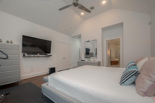 bedroom with ensuite bath, hardwood / wood-style flooring, a closet, vaulted ceiling, and ceiling fan