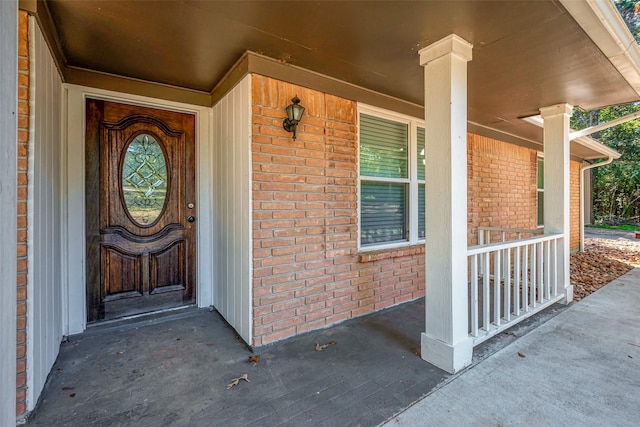 property entrance with covered porch