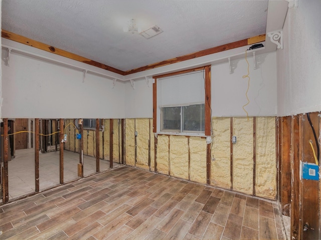 basement featuring hardwood / wood-style floors