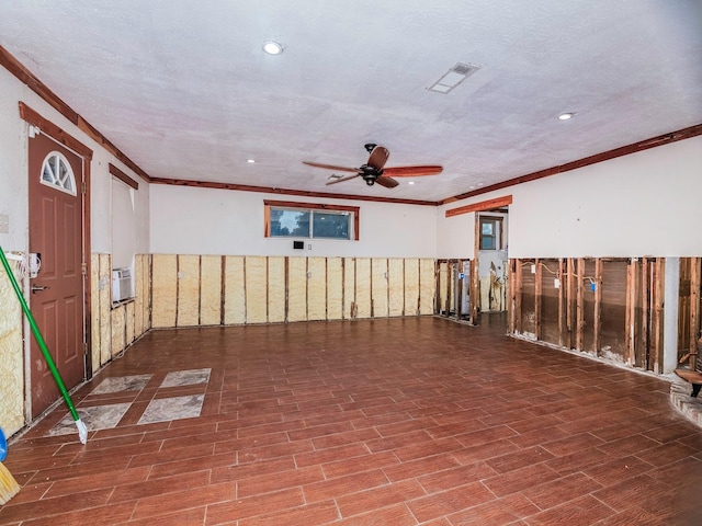 unfurnished room with crown molding, ceiling fan, and a textured ceiling