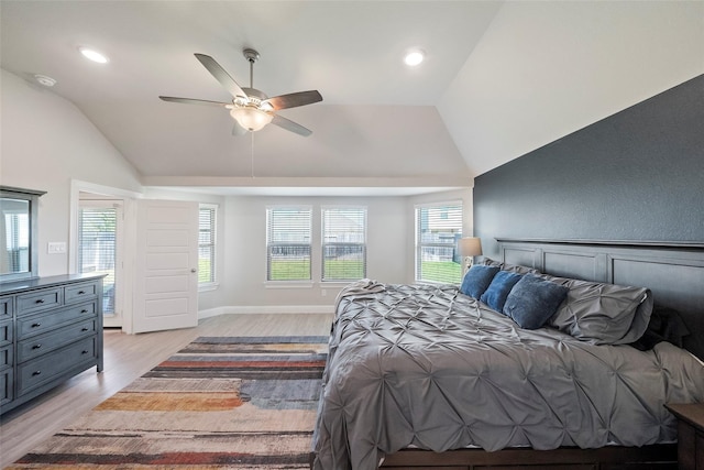 bedroom featuring lofted ceiling, light wood-type flooring, and ceiling fan