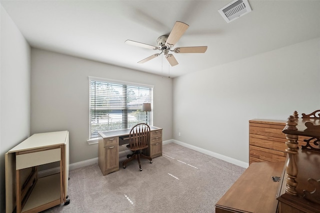 carpeted office space with ceiling fan