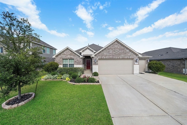 view of front facade with a front yard and a garage