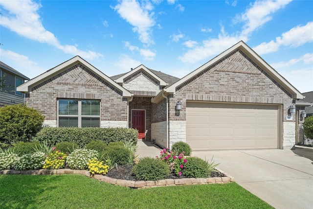 view of front of property with a garage and a front yard