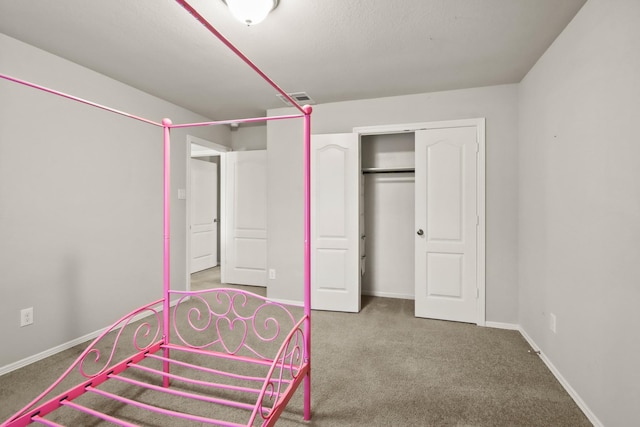 unfurnished bedroom with carpet floors and a closet