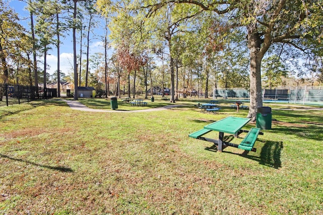 view of property's community featuring a lawn