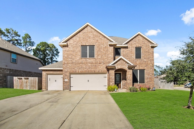 view of front of home featuring a front lawn and a garage