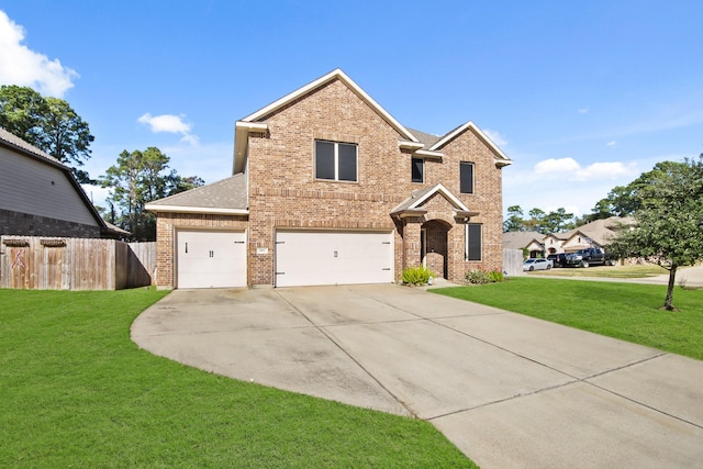 view of property featuring a garage and a front lawn