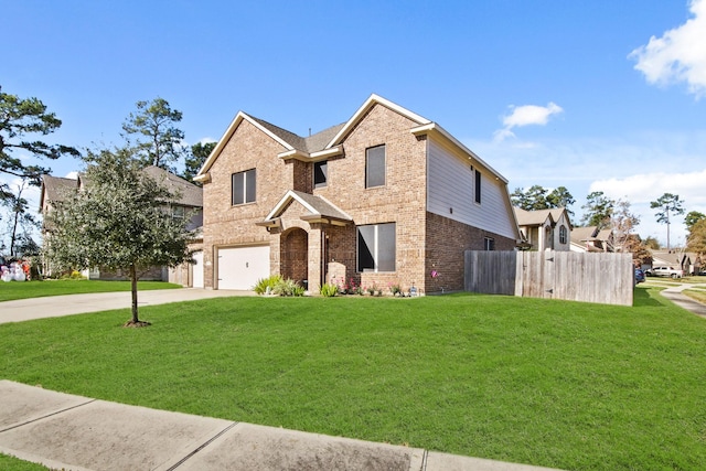 view of property featuring a garage and a front lawn