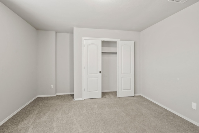 unfurnished bedroom with light carpet