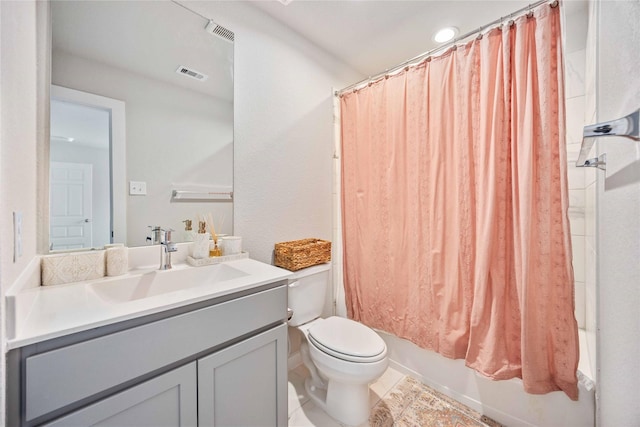 full bathroom with vanity, toilet, and shower / bath combo with shower curtain