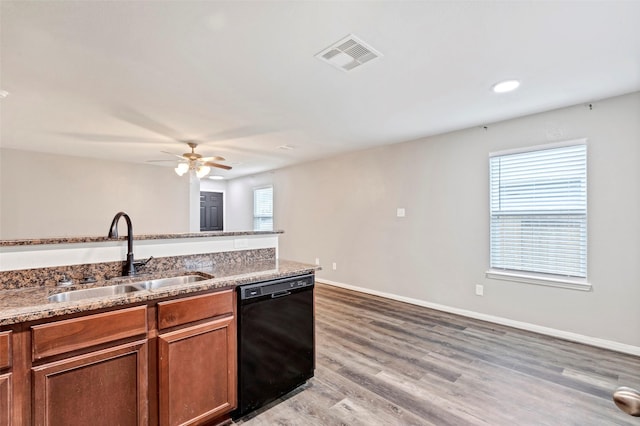 kitchen with a wealth of natural light, ceiling fan, dishwasher, and sink