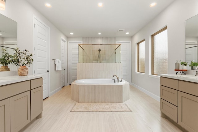 bathroom featuring separate shower and tub, tile patterned flooring, and vanity