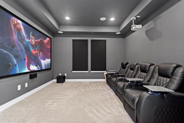 carpeted cinema featuring a raised ceiling