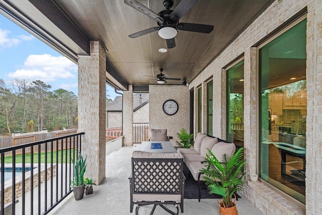 balcony featuring ceiling fan and an outdoor hangout area