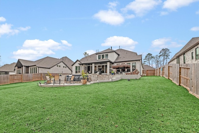 rear view of property with a patio area and a lawn