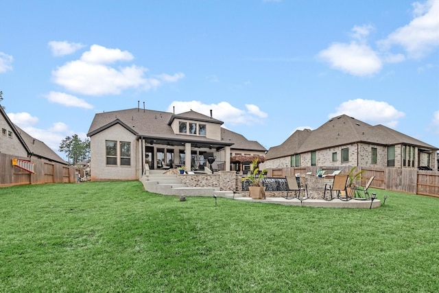 back of property featuring a patio and a lawn