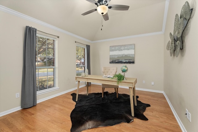 office featuring baseboards, light wood finished floors, ceiling fan, vaulted ceiling, and crown molding