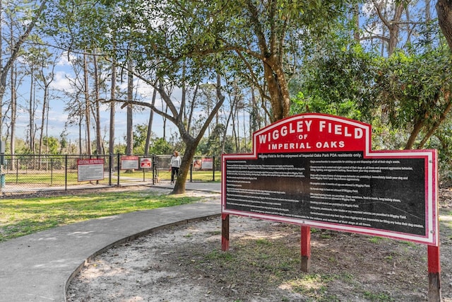 view of community featuring fence