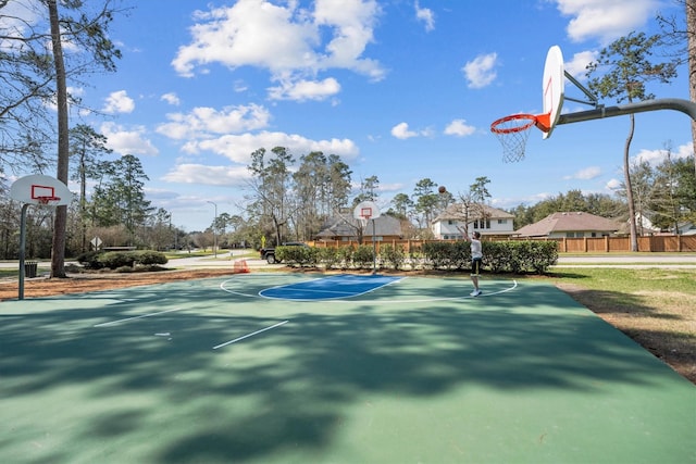 view of sport court featuring community basketball court and fence