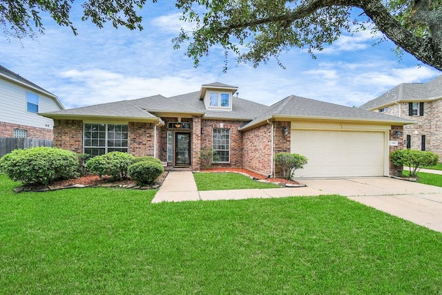 view of front of house featuring a front lawn and a garage