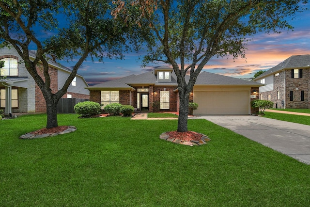 view of front facade featuring a yard and a garage