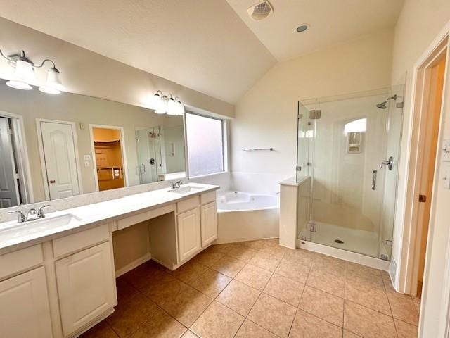 bathroom with plus walk in shower, vanity, lofted ceiling, and tile patterned flooring