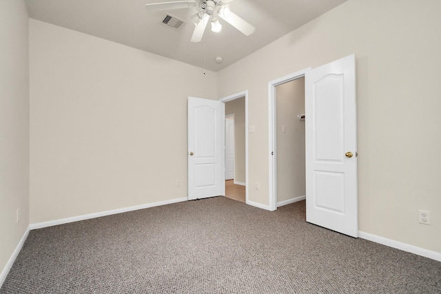 unfurnished bedroom with ceiling fan and carpet floors