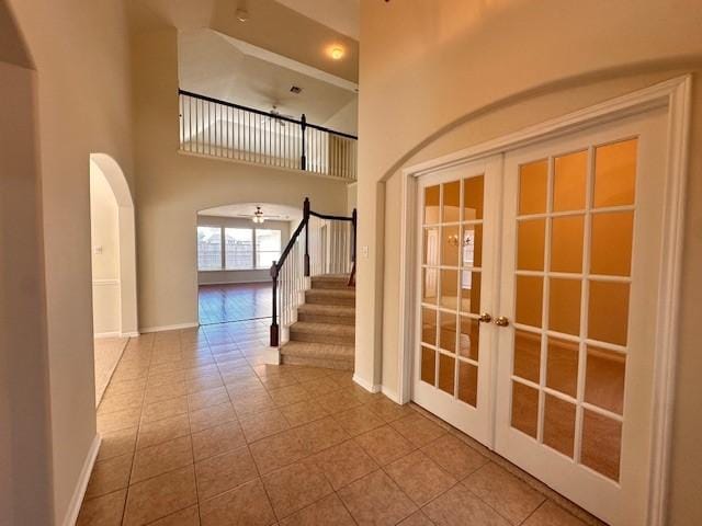 interior space with a high ceiling and french doors