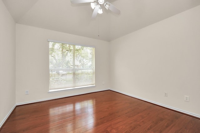 spare room with wood-type flooring, ceiling fan, and lofted ceiling