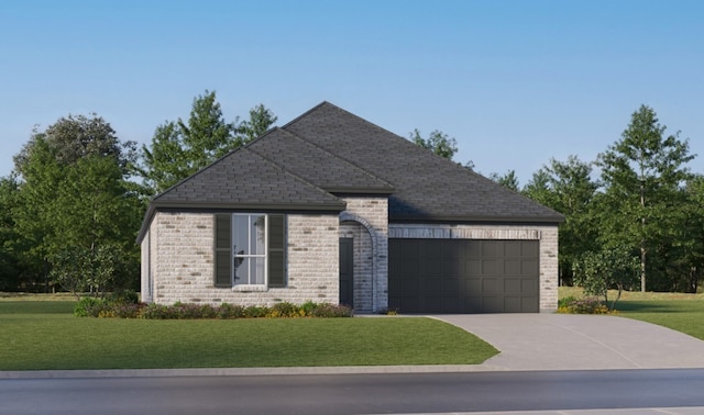 view of front of house with a garage and a front lawn