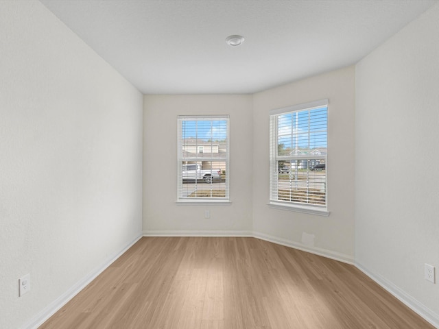 empty room with light wood-type flooring