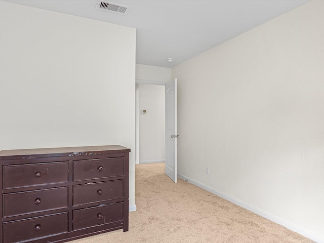 unfurnished bedroom with light colored carpet