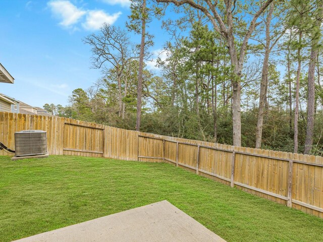 view of yard featuring central AC