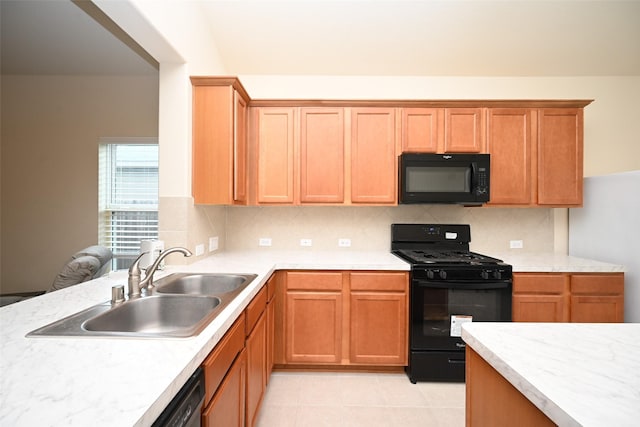 kitchen featuring light tile patterned floors, sink, backsplash, and black appliances