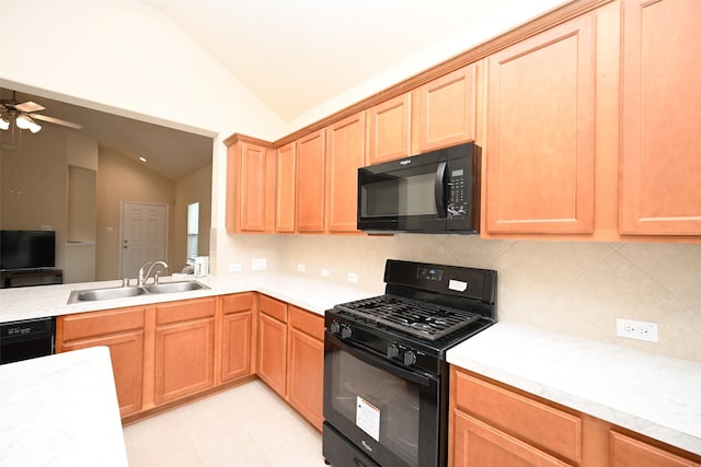 kitchen with ceiling fan, sink, backsplash, vaulted ceiling, and black appliances