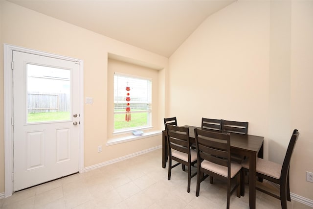 dining area with vaulted ceiling