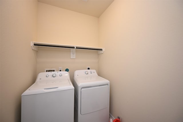 laundry area featuring washing machine and clothes dryer